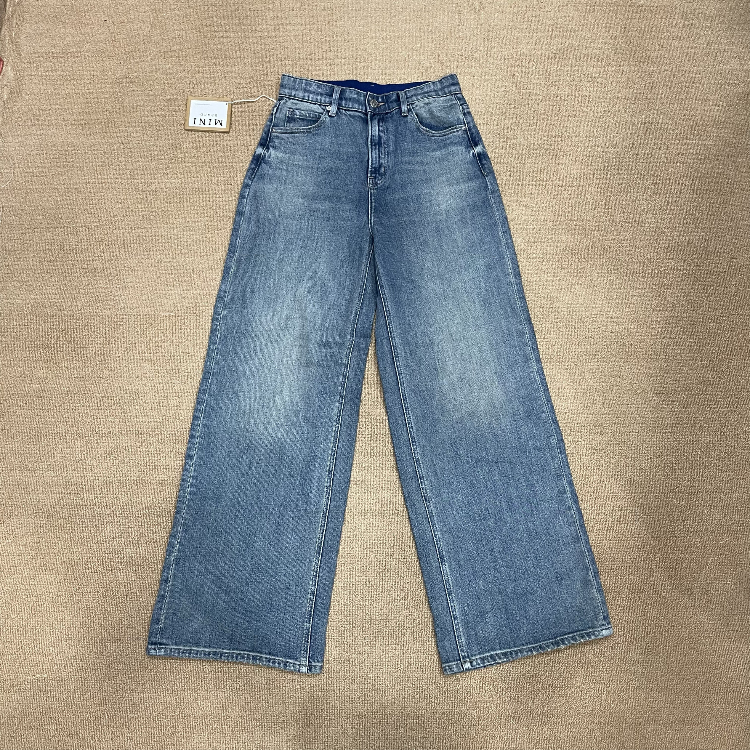 MiniJeans blu nuovi di zecca con elastico a vita alta elasticizzati a gamba larga dal taglio dritto che allungano le gambe e nascondono pantaloni di carne