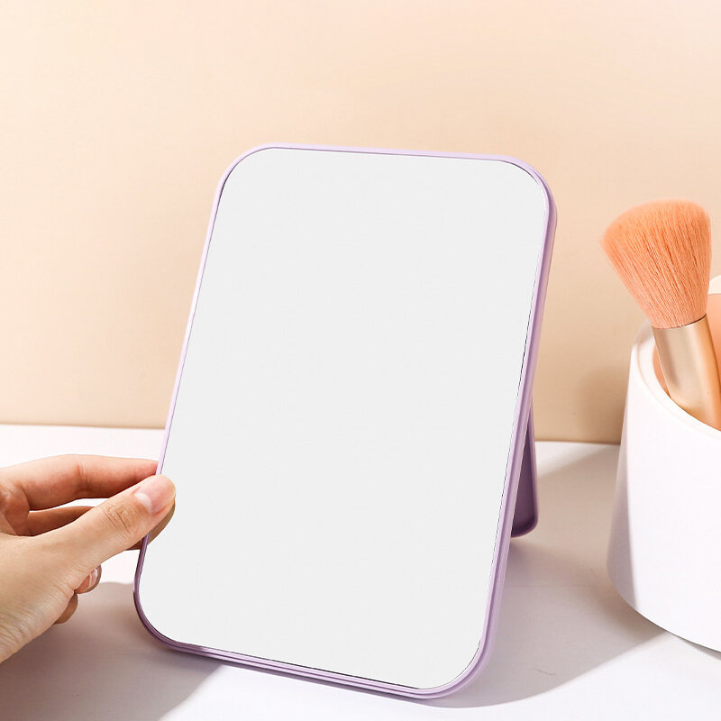 กระจกแต่งหน้าแบบพับได้กระจกโต๊ะเครื่องแป้งทรงสี่เหลี่ยมกระจกเครื่องสำอางกระจกหน้าเดียวทรงสี่เหลี่ยมพร้อมขาตั้งสำหรับผู้หญิงและผู้ชาย ราคา  8 บาท*ส่งฟรี