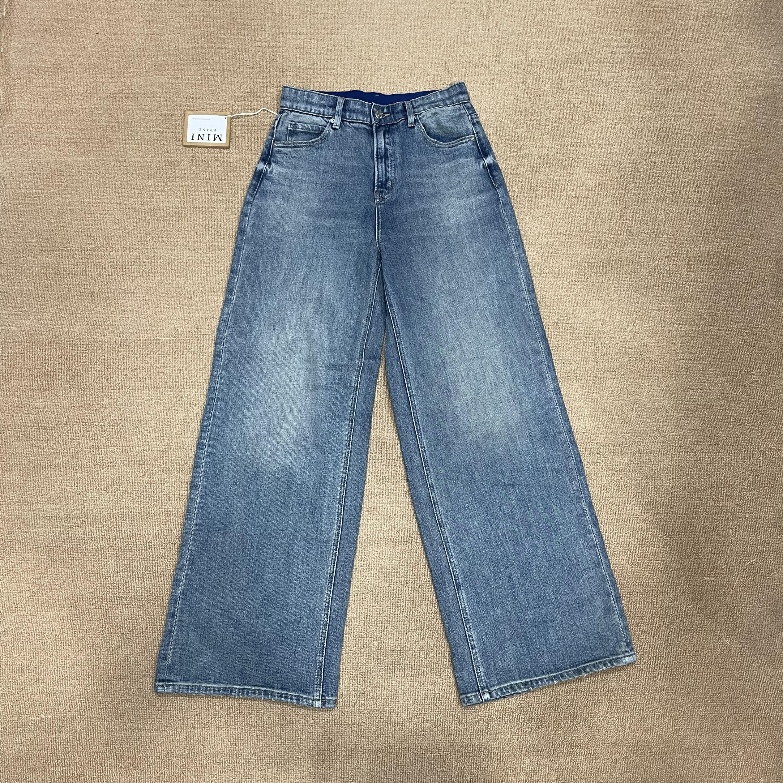 MiniJeans blu nuovi di zecca con elastico a vita alta elasticizzati a gamba larga dal taglio dritto che allungano le gambe e nascondono pantaloni di carne