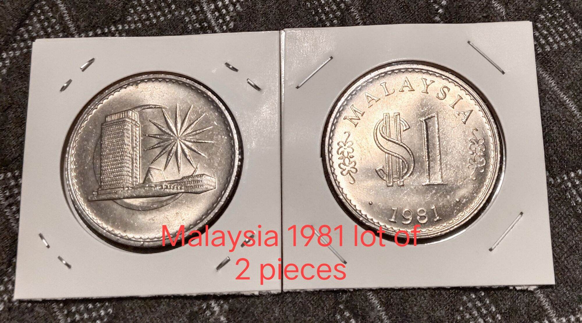 Matching pairs of Singapore and Malaysia $1 coin