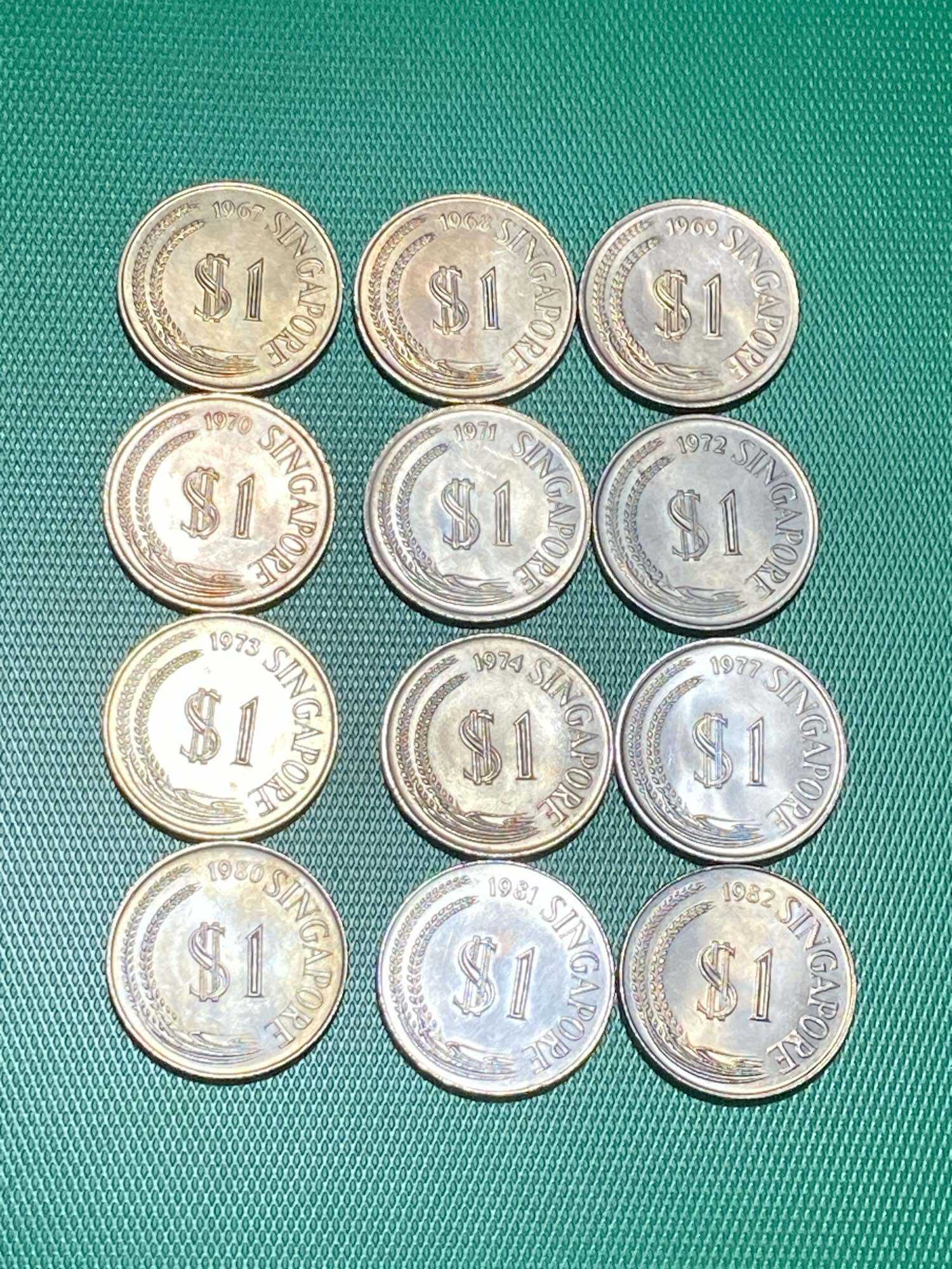 12 pcs from 1967-1982 Singapore Merlion $1 coins