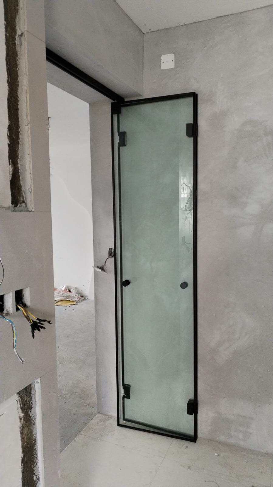 10mm clear tempered glass bi-fold door w/black frame. 