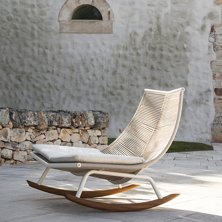 grey plastic chair with wooden legs